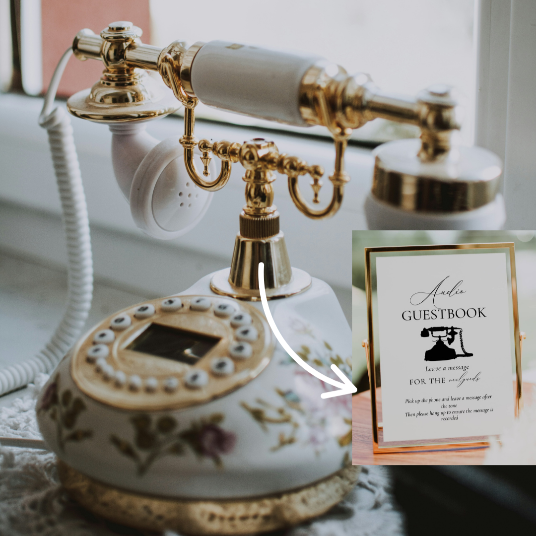 Vintage-style phone with decorative elements on a table, next to a guestbook sign.