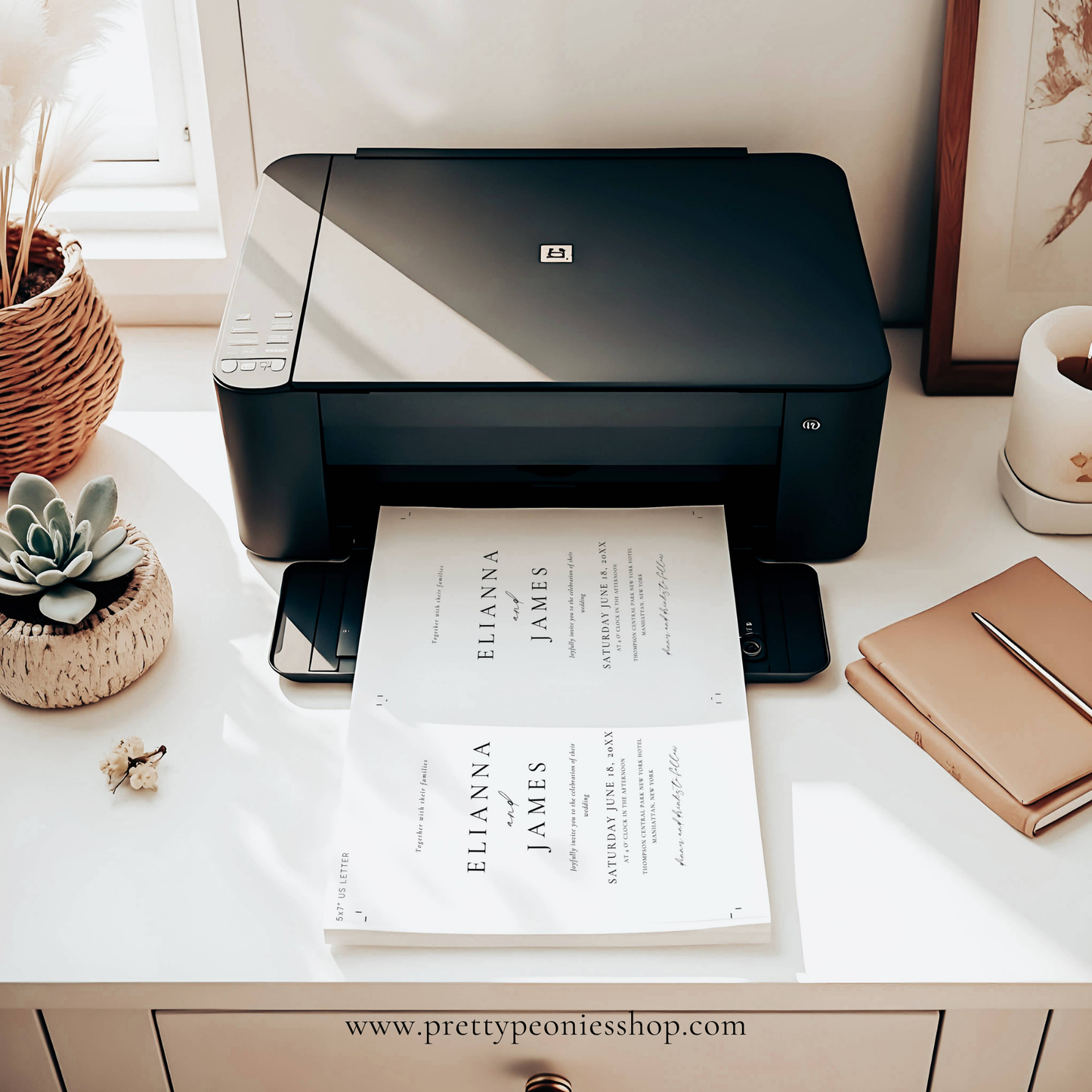 Black printer on a desk with printed paper, notebook, and small plant.