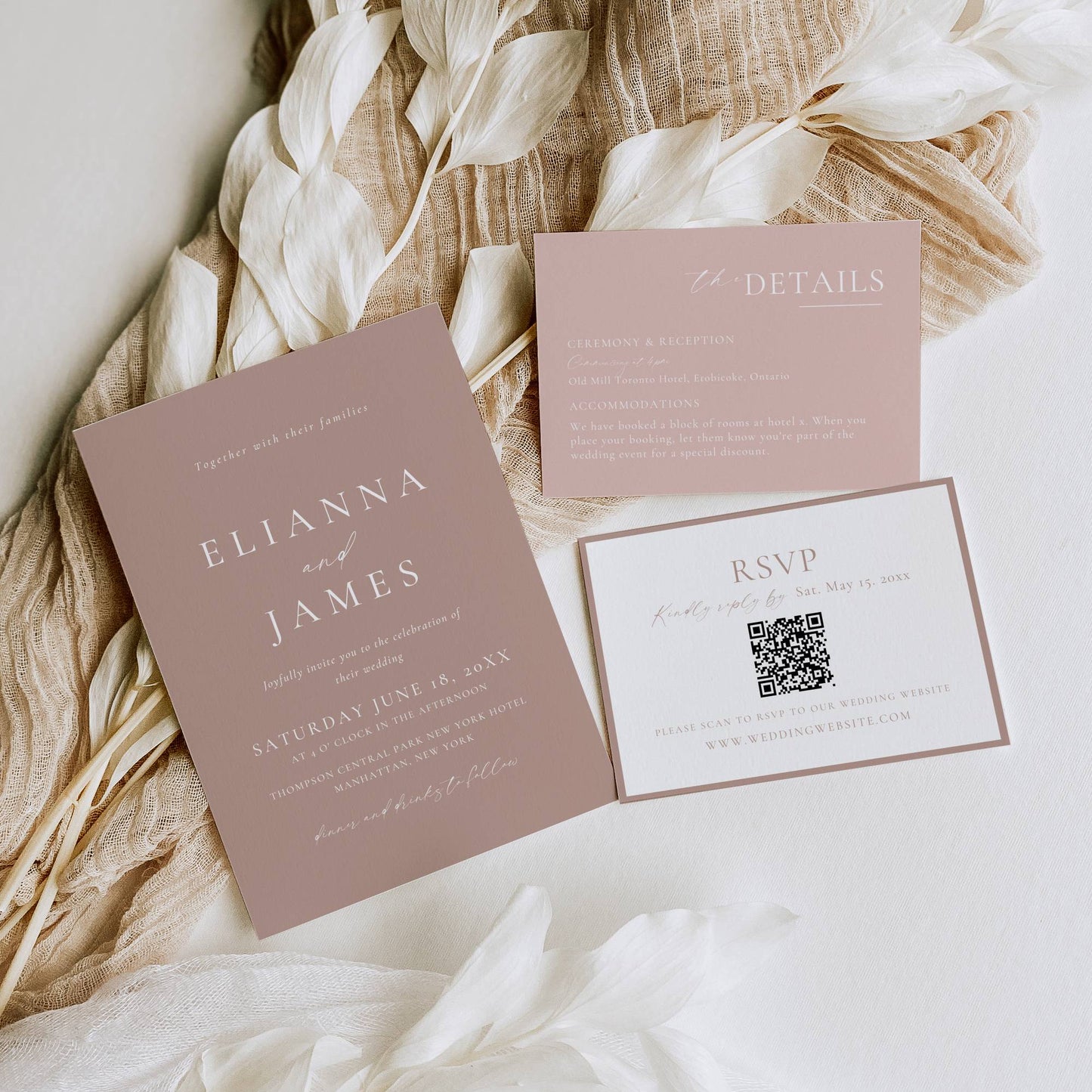 Wedding invitation set with RSVP card on a soft fabric background