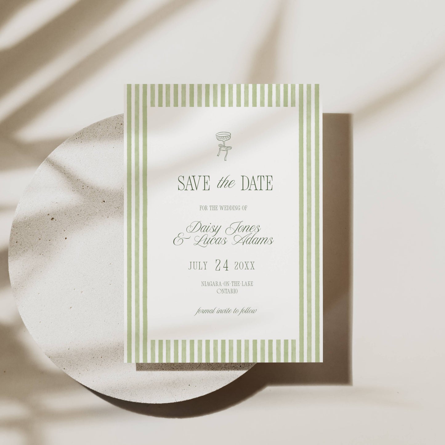 Wedding invitation card with floral design on a light background