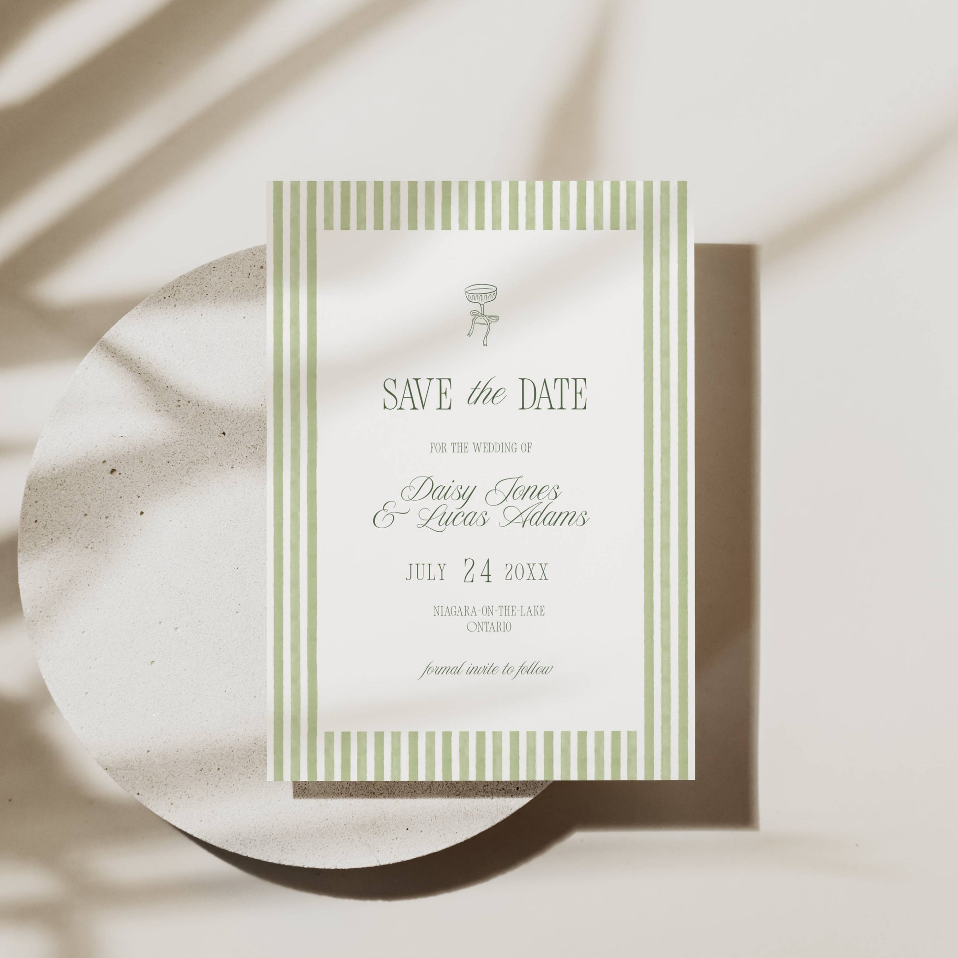 Wedding invitation card with floral design on a light background