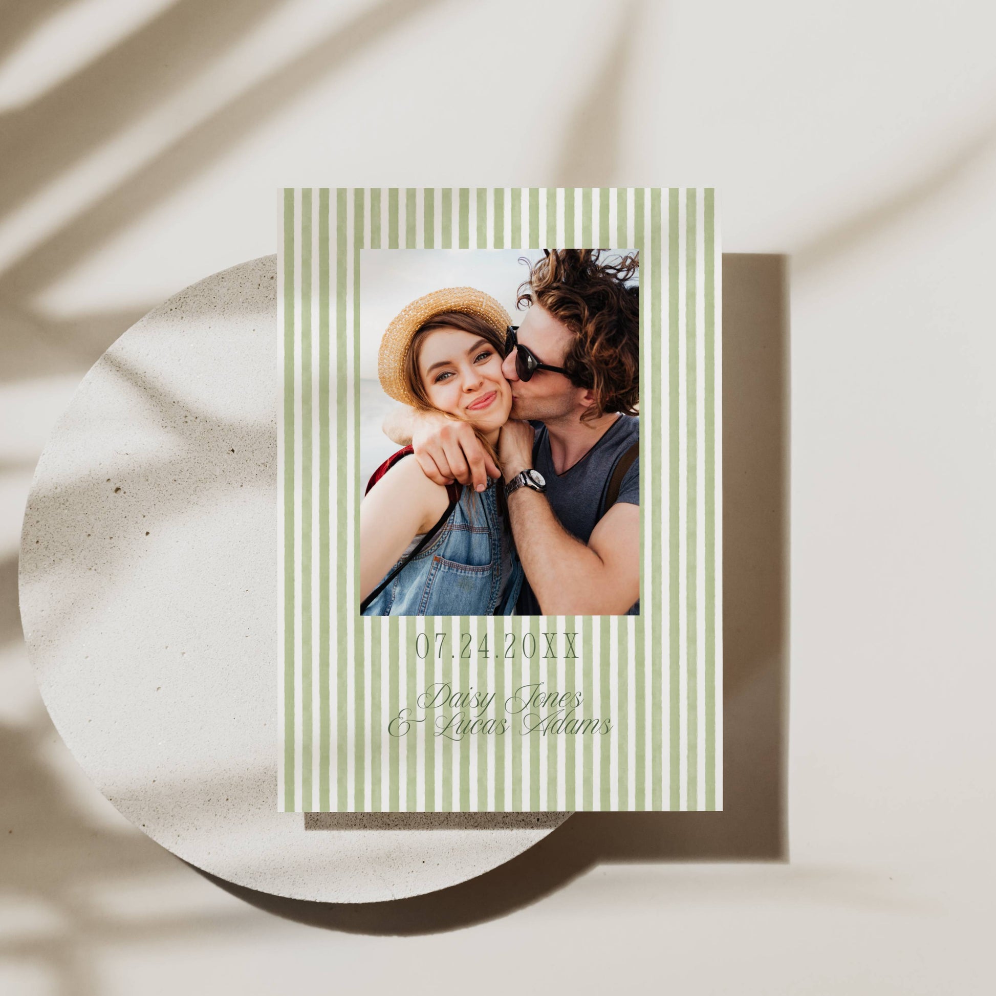 Greeting card with a photo of a couple on a white surface with shadows