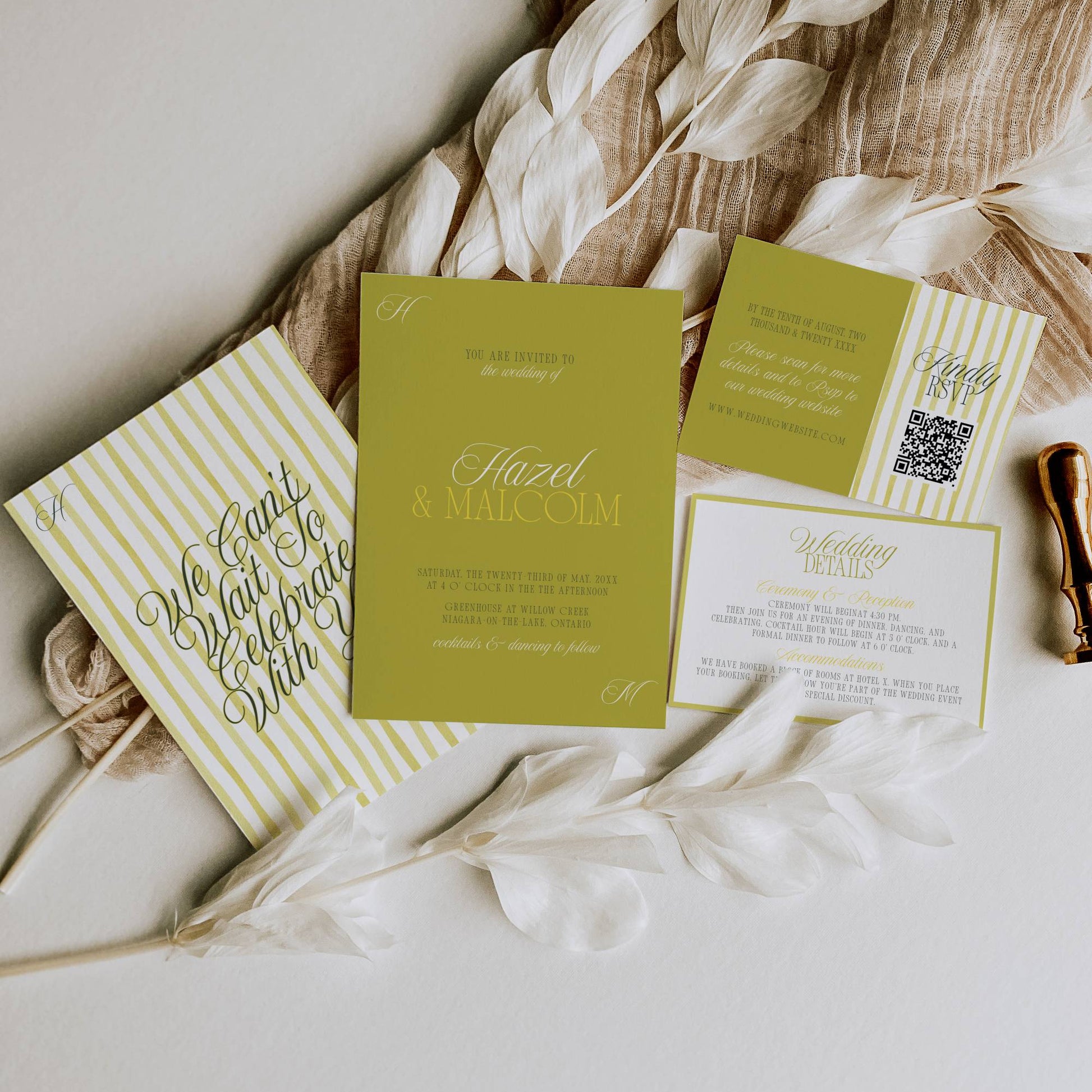 Set of wedding invitations with green and white design on a textured surface