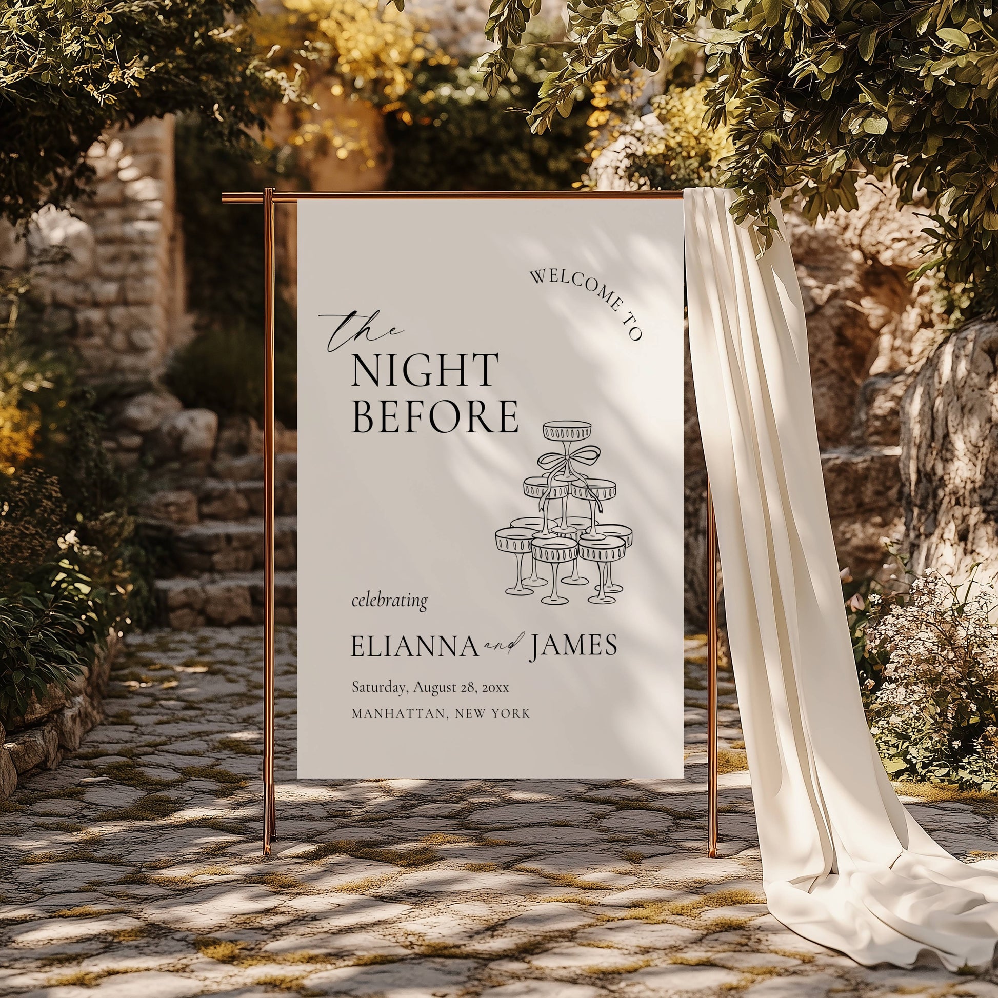 Wedding welcome sign with details on a stone pathway surrounded by greenery