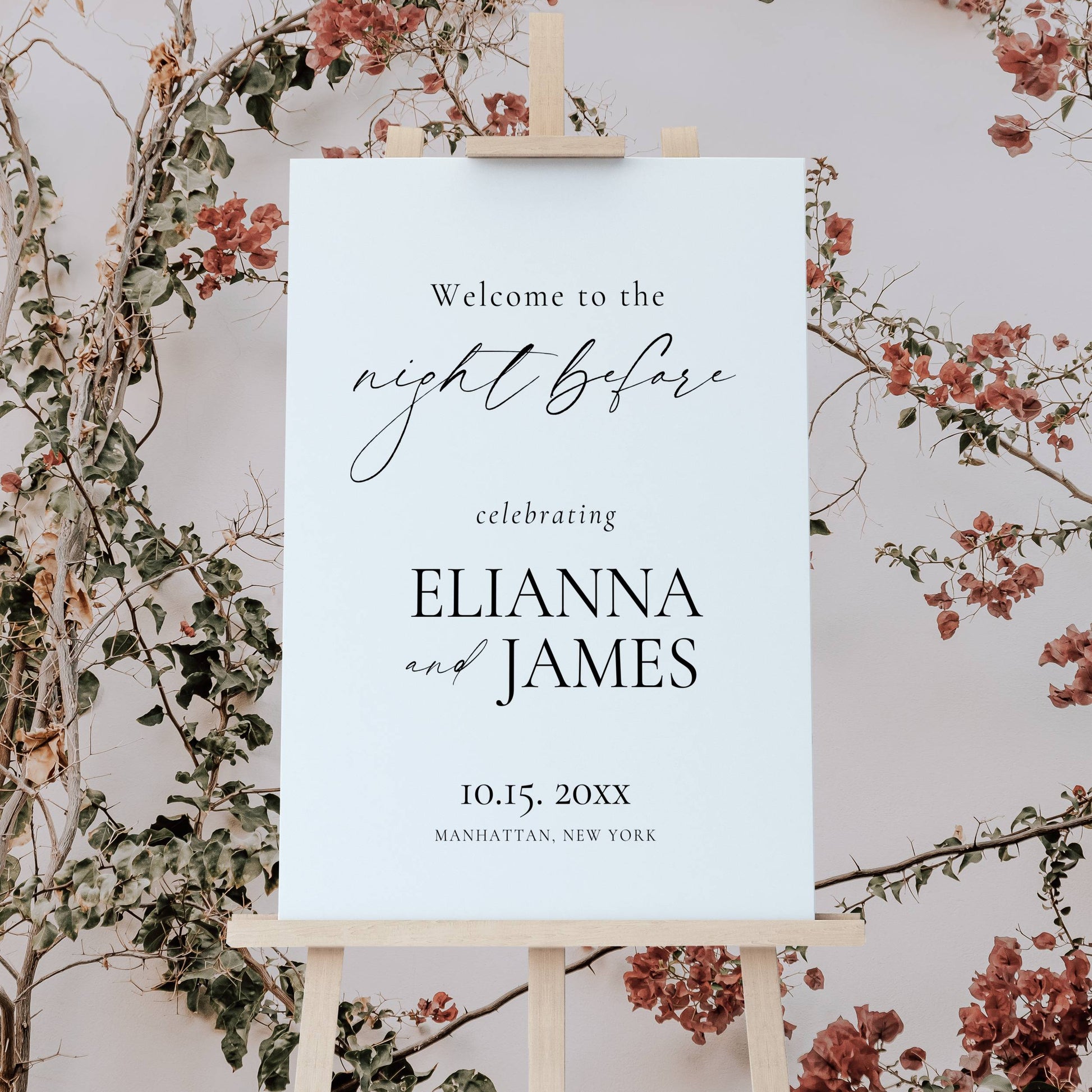 Wedding invitation card on an easel with floral decorations