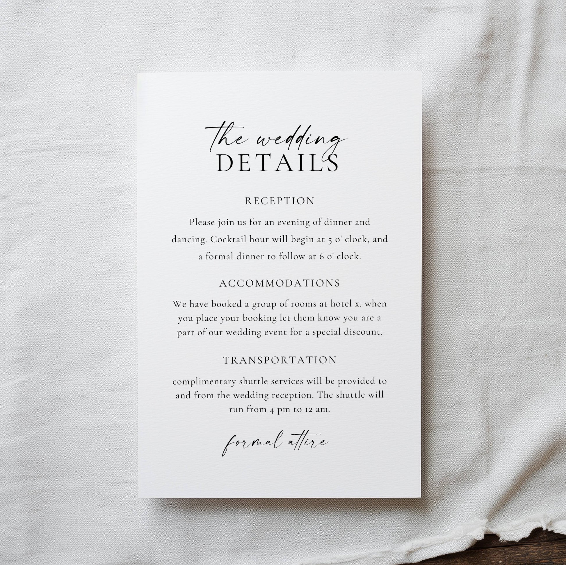 Wedding details card on a textured fabric background
