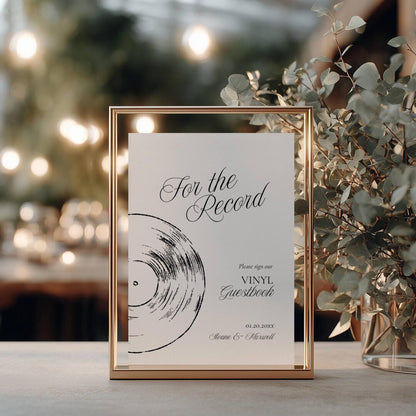 For the Record vinyl guestbook sign in a thin gold metal frame with a hand-drawn record illustration