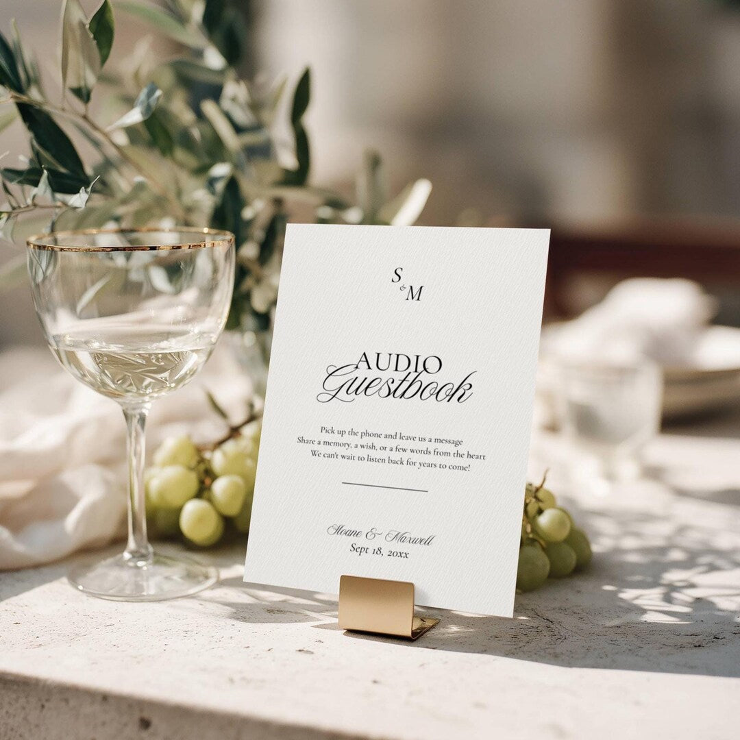 Old Money monogram audio guestbook sign on a gold metal stand with Pick up the phone and leave us a message script
