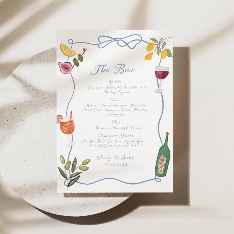 Dusty blue watercolor bar menu styled with couple's names and wedding date
