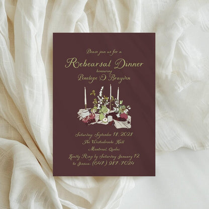 Burgundy floral rehearsal invitation with gold script honoring Penelope and Brayden