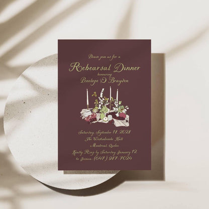 Burgundy floral wedding rehearsal invitation with gold script and RSVP details