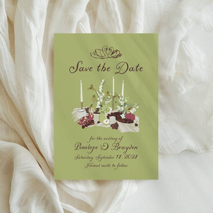 Sage green Save the Date with candlelit table setting illustration, florals, and fruit