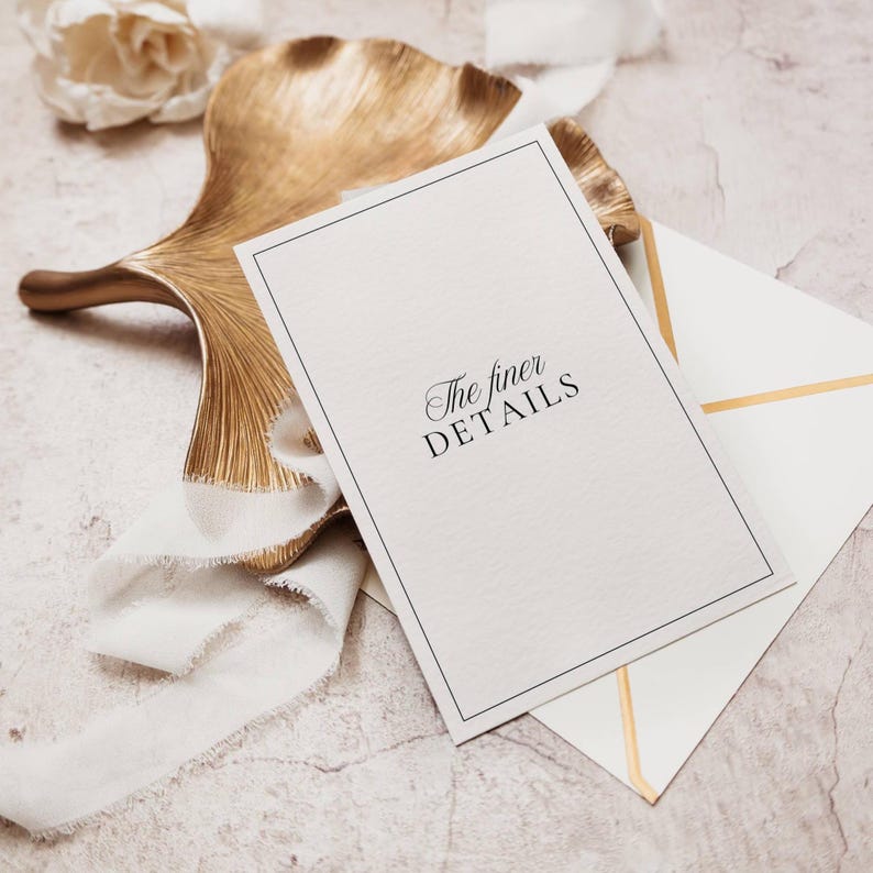 Details card styled on gold leaf dish with white envelope and ribbon