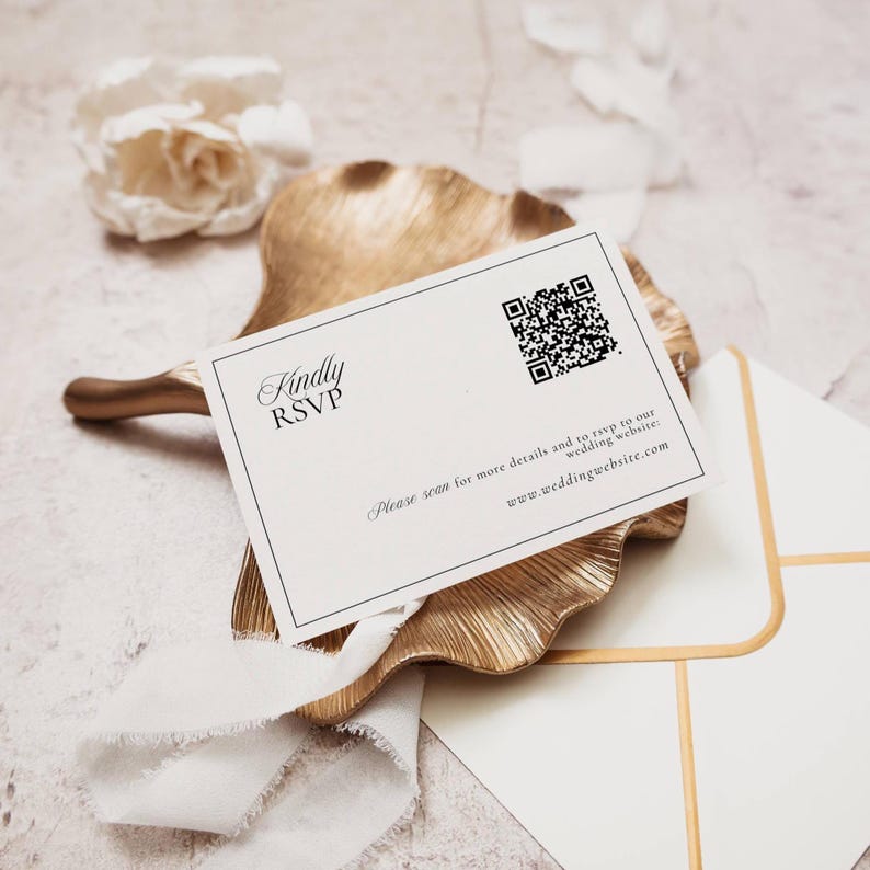 RSVP card with QR code linking guests to the wedding website styled on gold dish