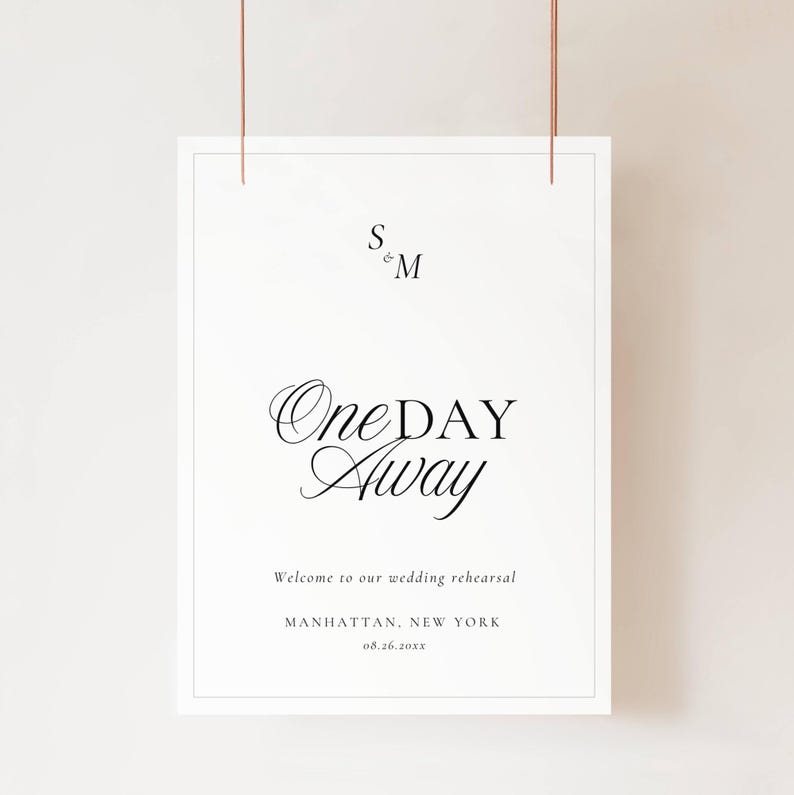 Black and white Old Money rehearsal welcome sign suspended by copper wires