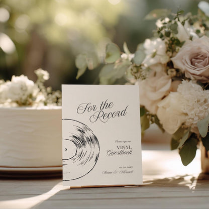 For the Record vinyl guestbook sign displayed on a stand with black serif and script typography