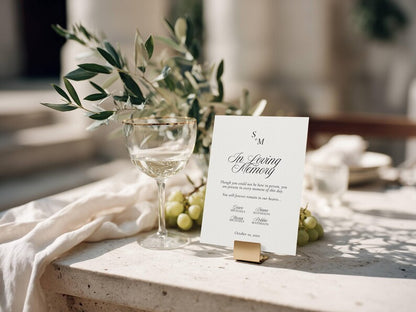 In loving memory sign with monogram held upright by a small gold stand