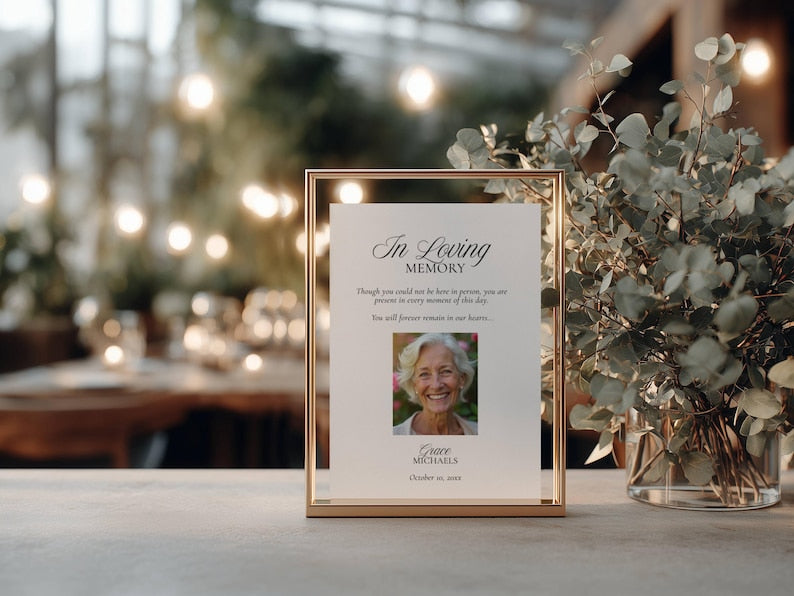 Photo in loving memory sign displayed in a gold metal frame