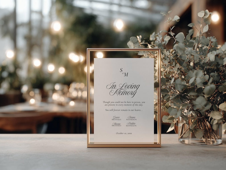 In loving memory sign in a thin gold metal frame displayed upright