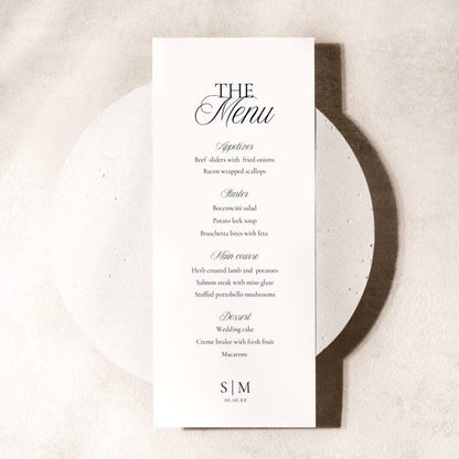 Tall white wedding menu card with black text listing Appetizer, Starter, Main course, and Dessert sections with initials S|M and date