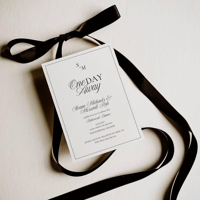 Rehearsal invitation styled shot showing the monogram and wedding date