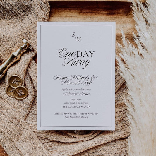 Black and white Old Money rehearsal invitation styled with monogram and script