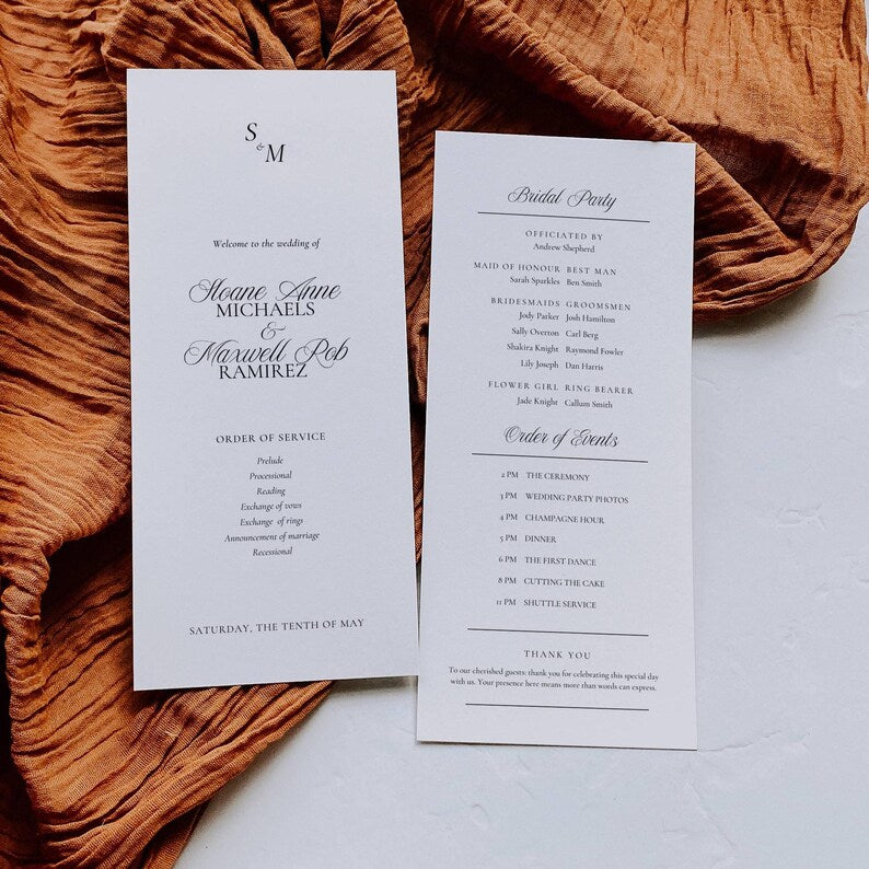 Wedding program template shown flat on a wood table surface