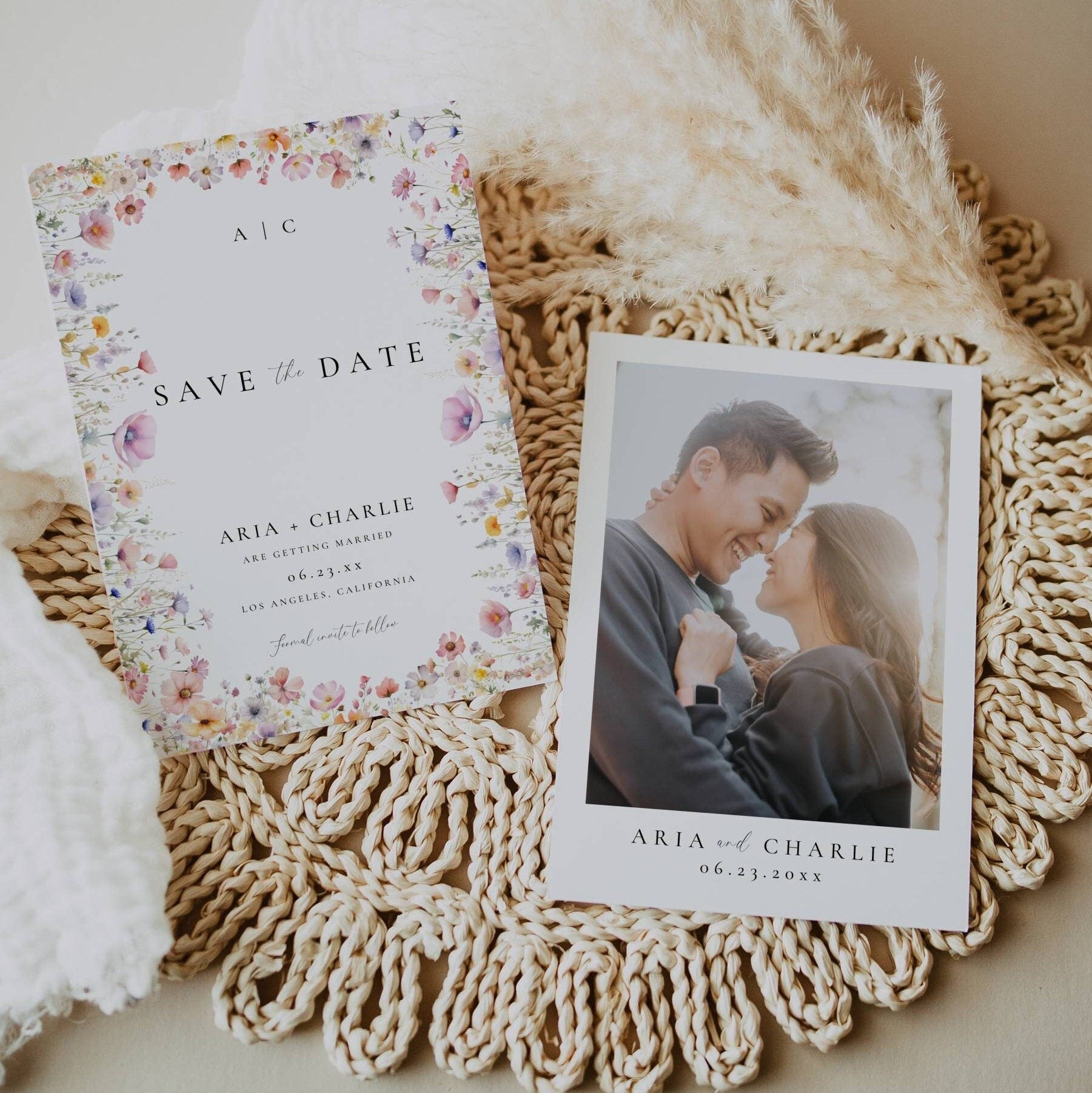 A wildflower wedding save the date with photo on a neutral elegant placemat with pampas grass