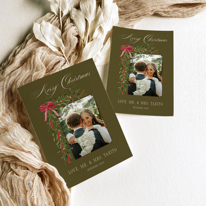 Olive green Mr and Mrs Christmas photo card template shown in two sizes with dried leaves and linen ribbon
