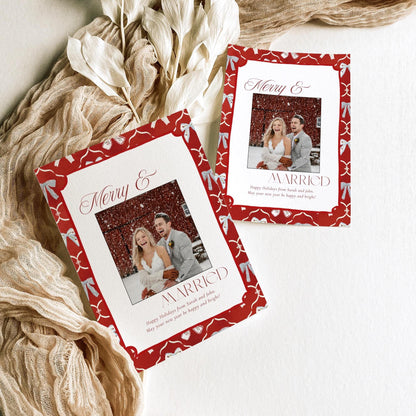 First Christmas married photo card with red and blue bow border, styled with holiday details