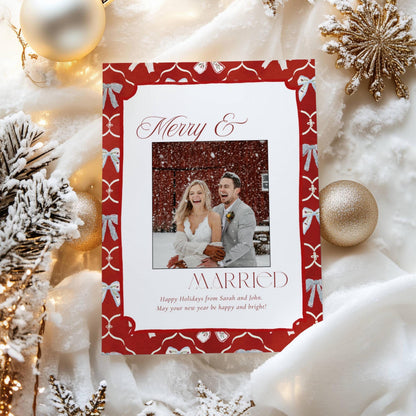 Red Merry and Married newlywed Christmas photo card with a hand-painted blue bow border, 5x7 Canva template