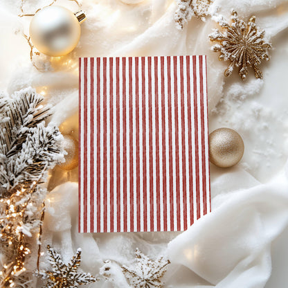 Hand-painted red and white stripe card back surrounded by gold ornaments and snowy fir branches